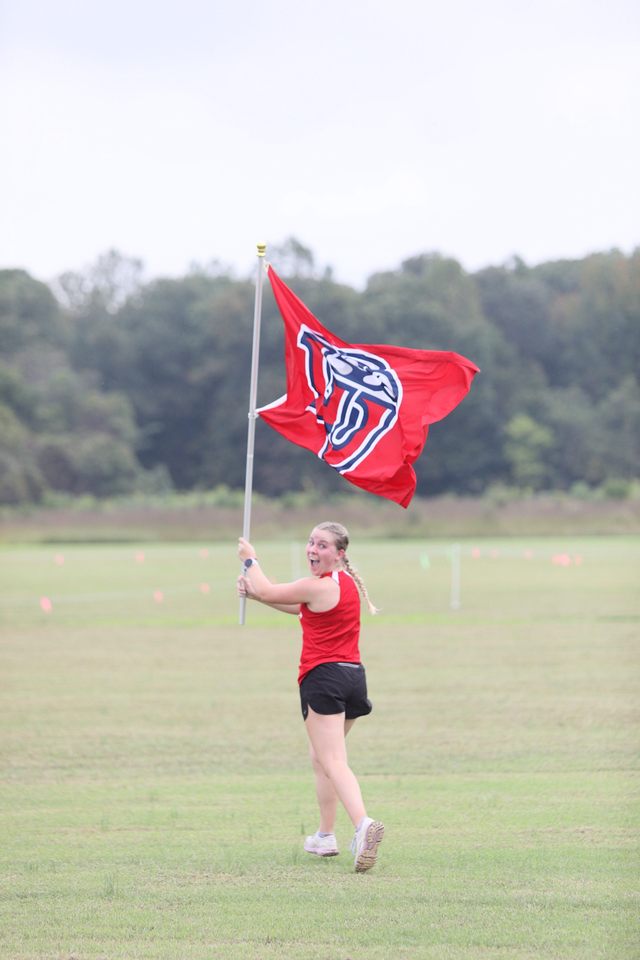 Runner with team flag